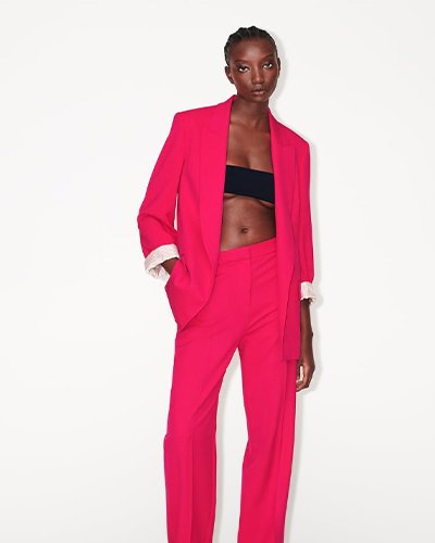 Experience Elegance: A stylish affair with the left or right pink trousers and pink jacket from Zara